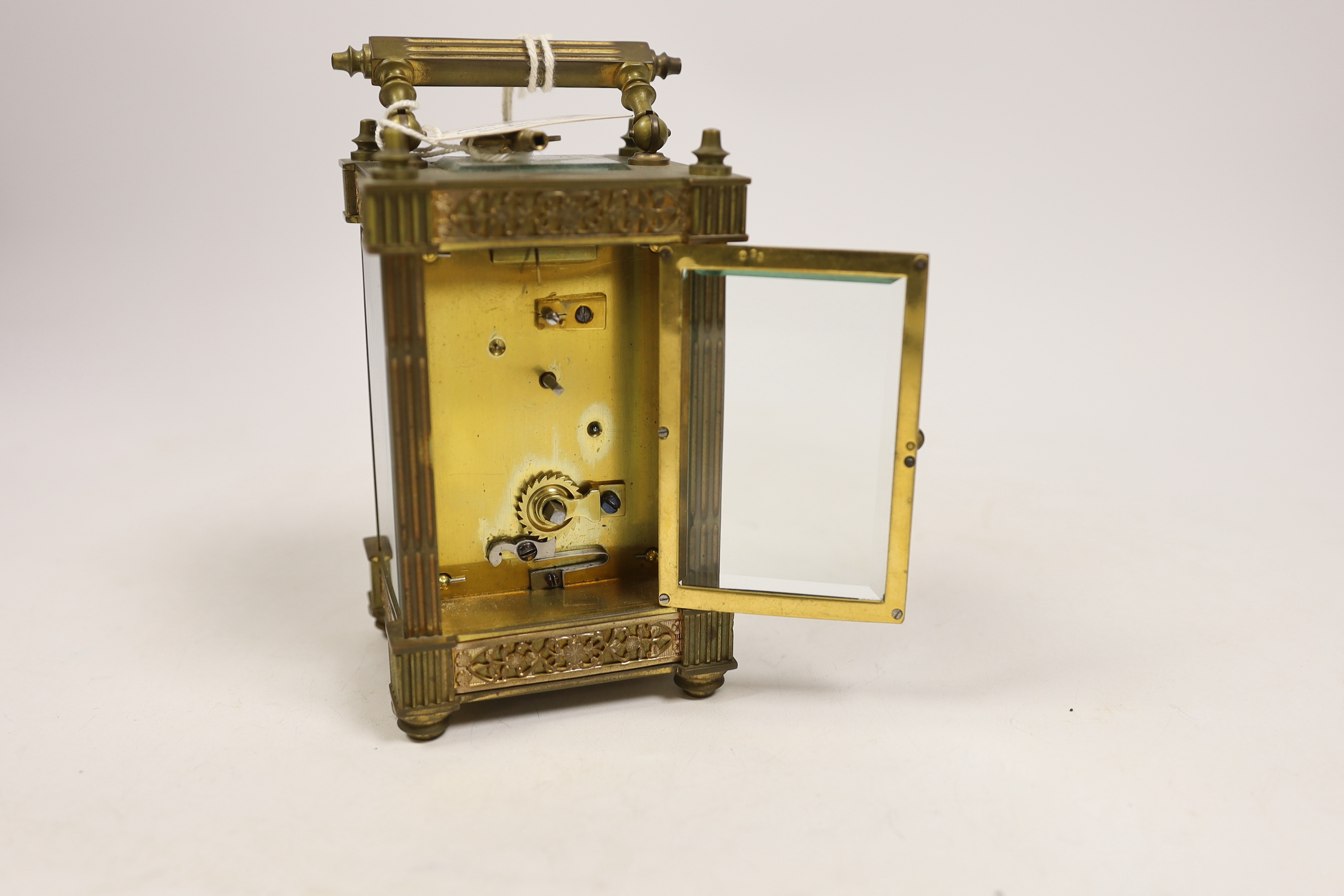 A brass carriage timepiece with square fluted columns, 13cm